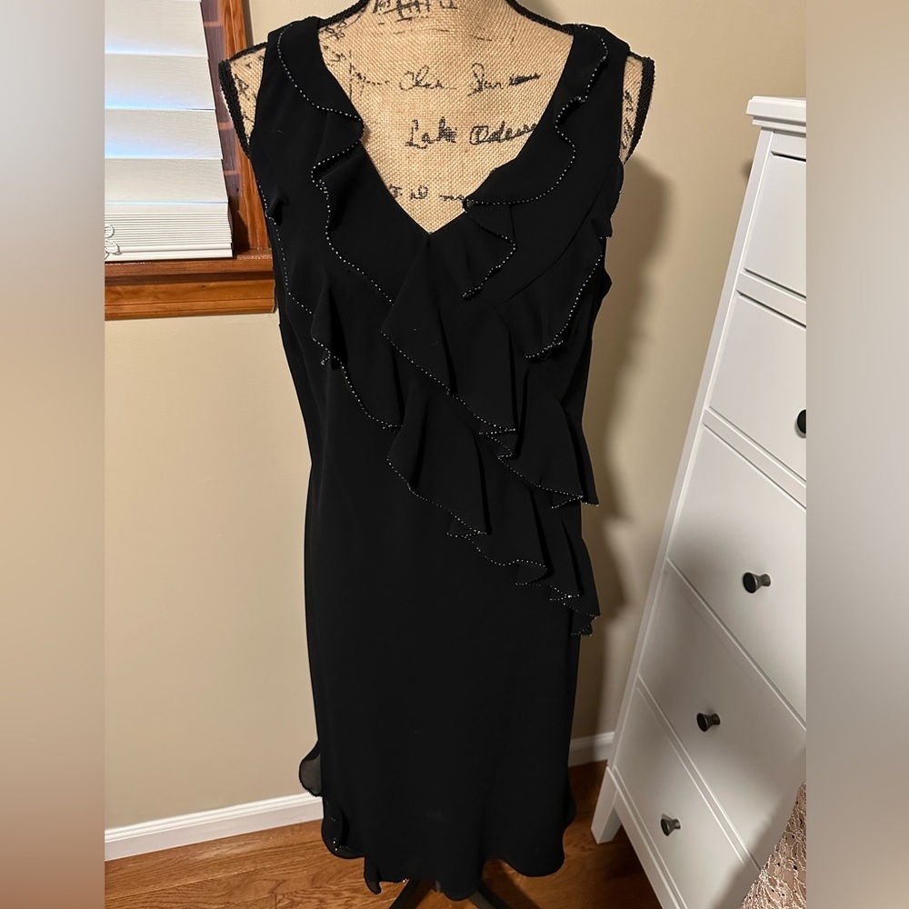Black fun and flirty dress with gorgeous beaded detail.